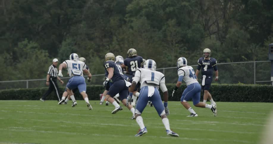 Football game where receiver catches pass