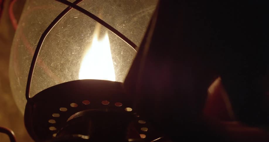 An oil lantern is turned on