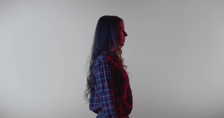 A woman stands completely still