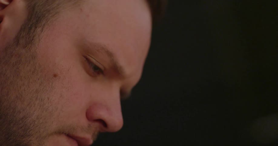 A man is concentrating as he works