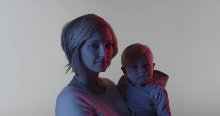A woman is holding a baby