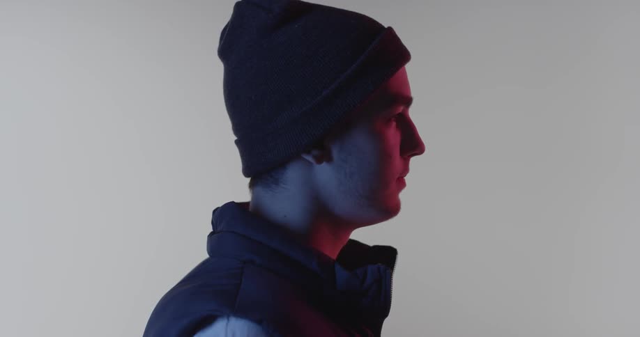 A man is standing and staring into the distance