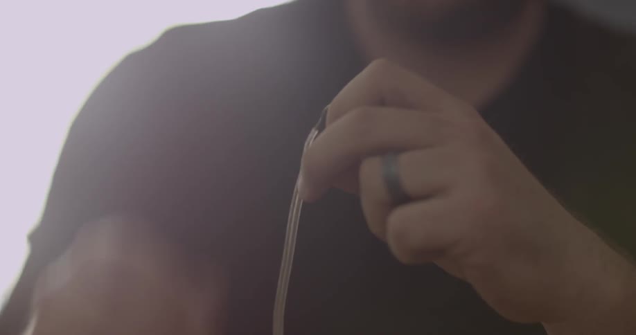 A man uses a screwdriver and pliers to fix something