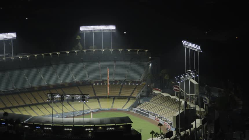 The large lights above the stadium light the grass