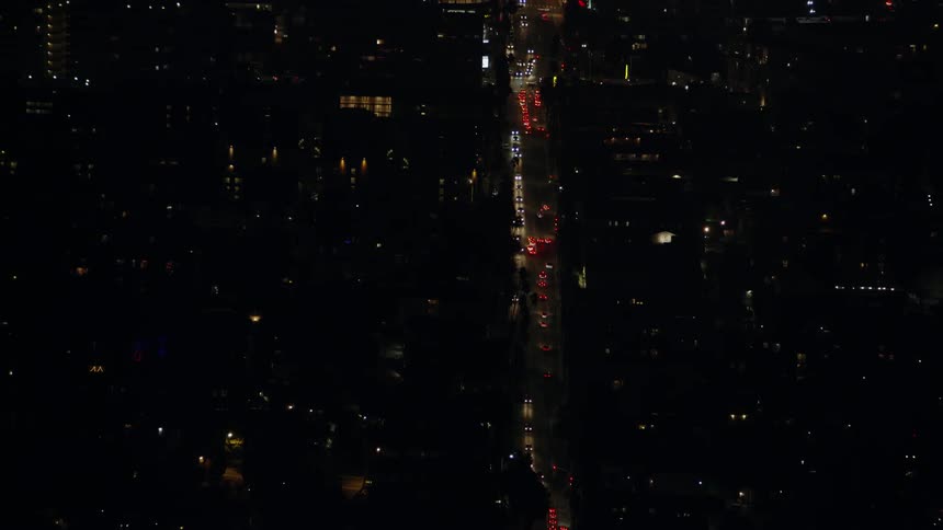 The stadium is being illuminated at night by strobe lights