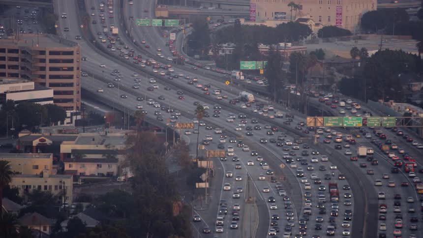Freeway traffic is backing up in los angeles at dusk