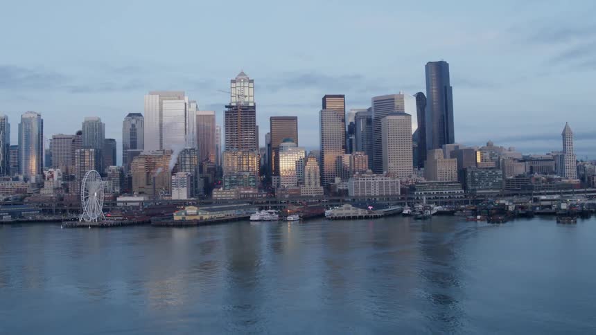 Flying past a ferry pulling into dock along the downtown Seattle waterfront