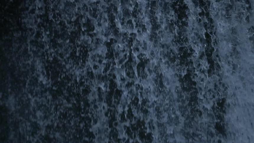 Water gushes over a waterfall