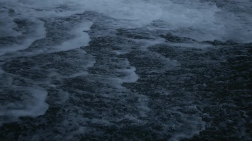 The tide flows onto the beach shore