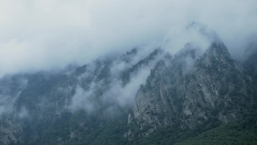 Haze lifts above a tall mountain