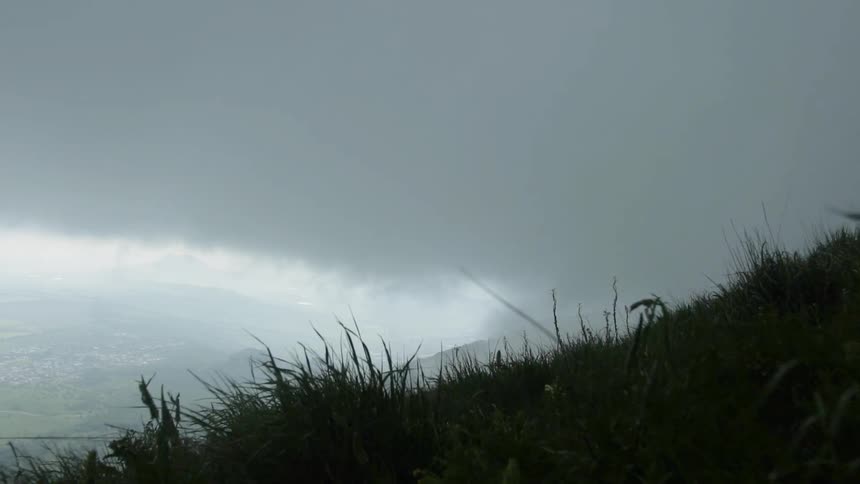 Grassy hillside on a very cloudy day