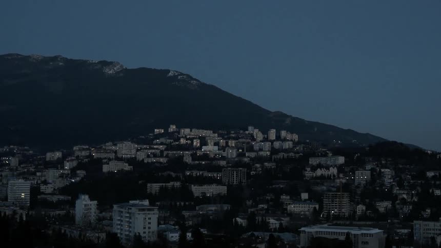 Buildings cover the landscape of a mountain town