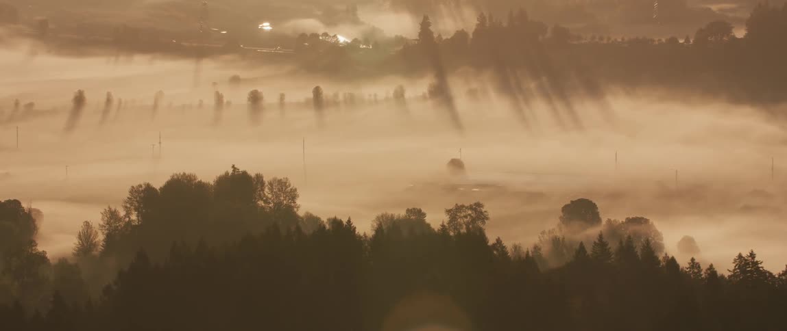 Haze sits above the surface as the sun rises