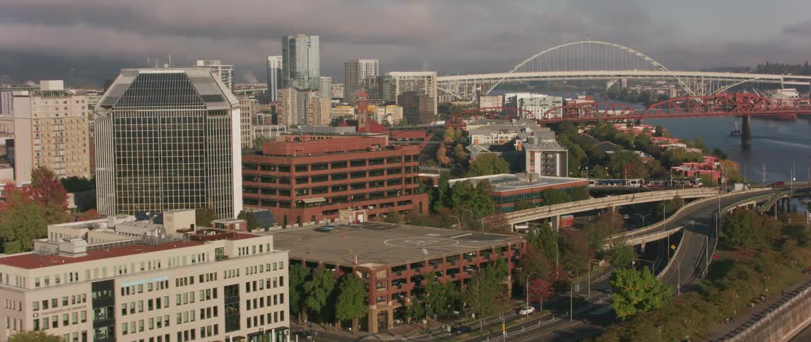 Vehicles travel over a city bridge