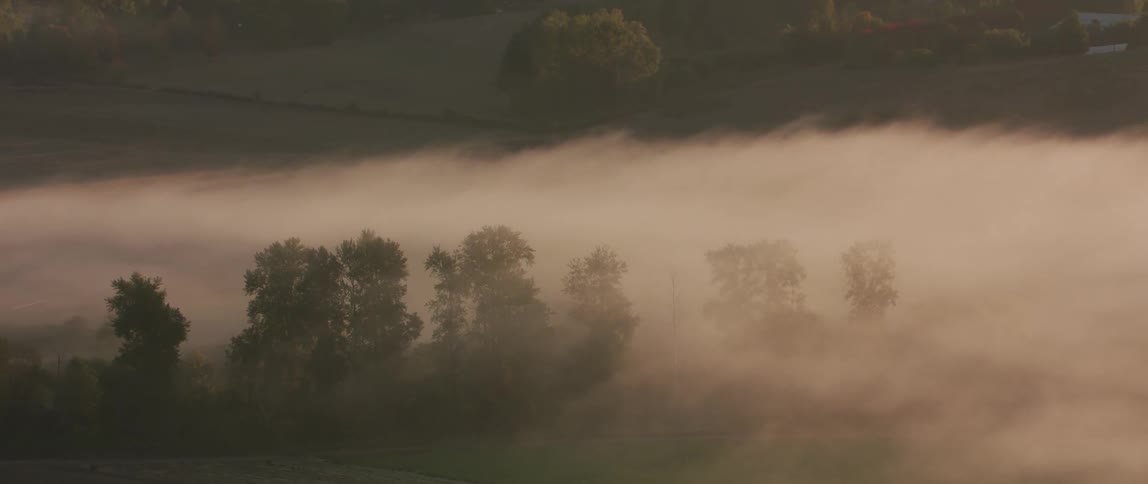 Fog lifts above the landscape