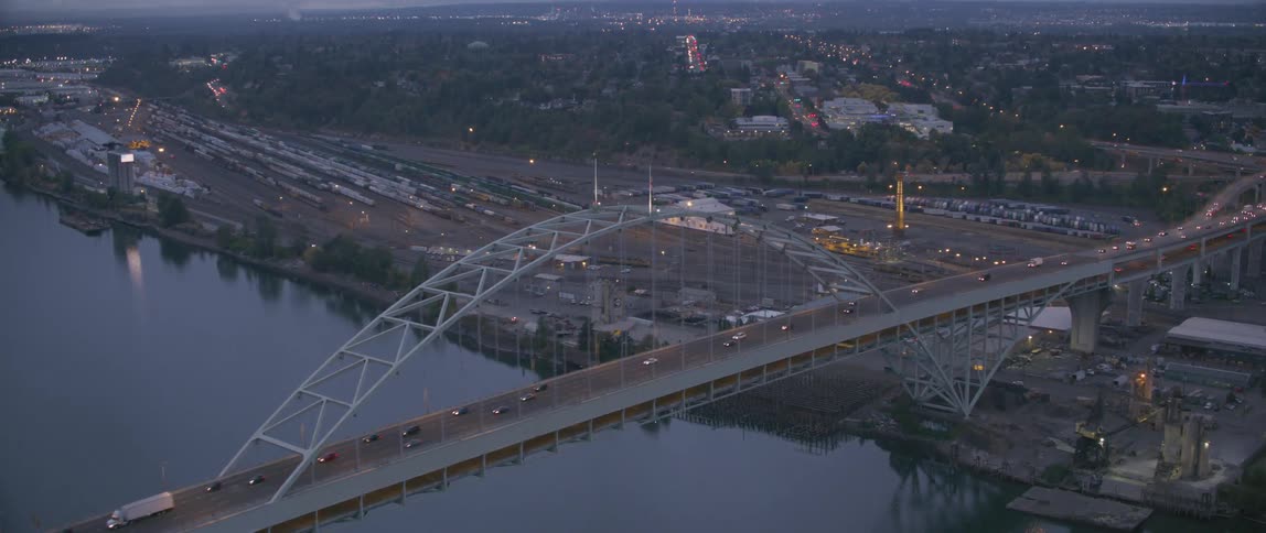 Vehicles travel over a city bridge