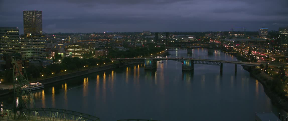 Vehicles travel over a city bridge