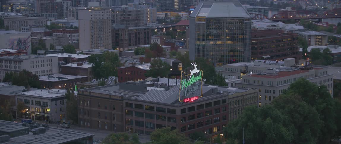 The portland oregon sign flashes at sunset