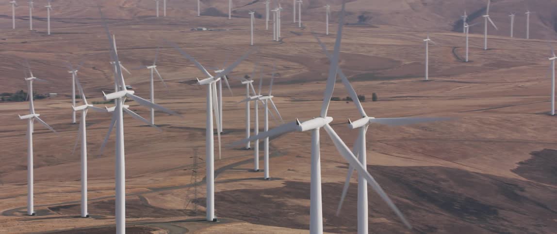 Wind turbines turning in a wind turbine field