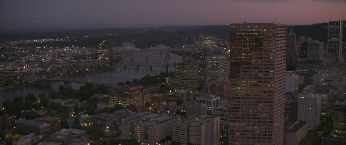 A tall city building towers into the sky