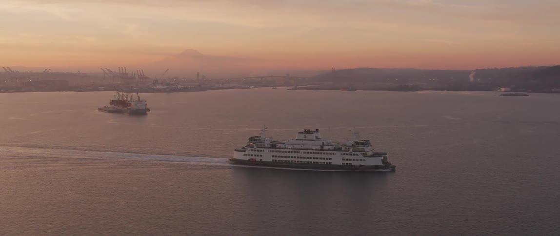 A ship motors across the harbor