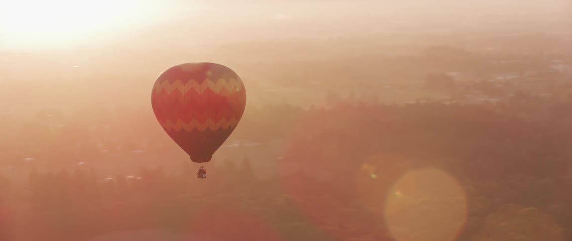 A hot air balloon floats in the sky