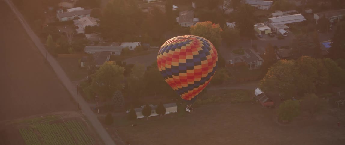 A hot air balloon floats in the sky