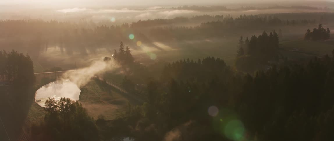 Fog and haze lift above the valley