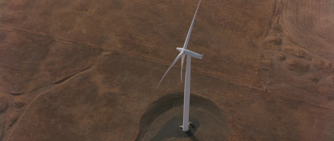 A wind turbine in an empty field