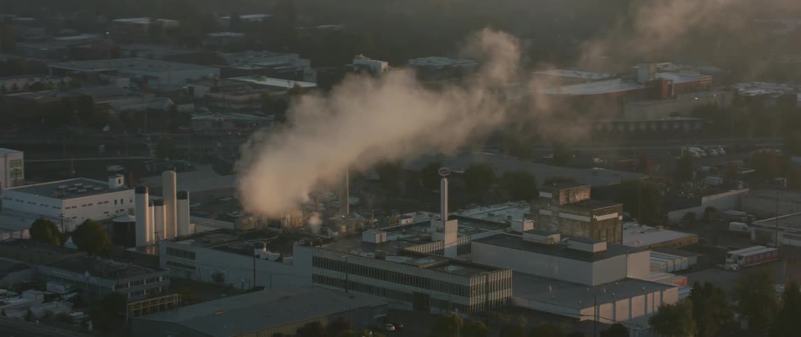 Smoke coming from smokestacks in an industrial area