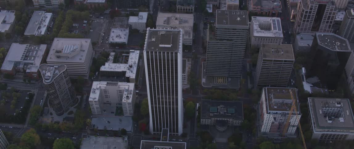 Tall city buildings tower into the sky