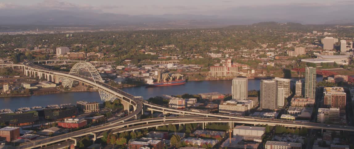 Traffic moves off the bridge and into the city