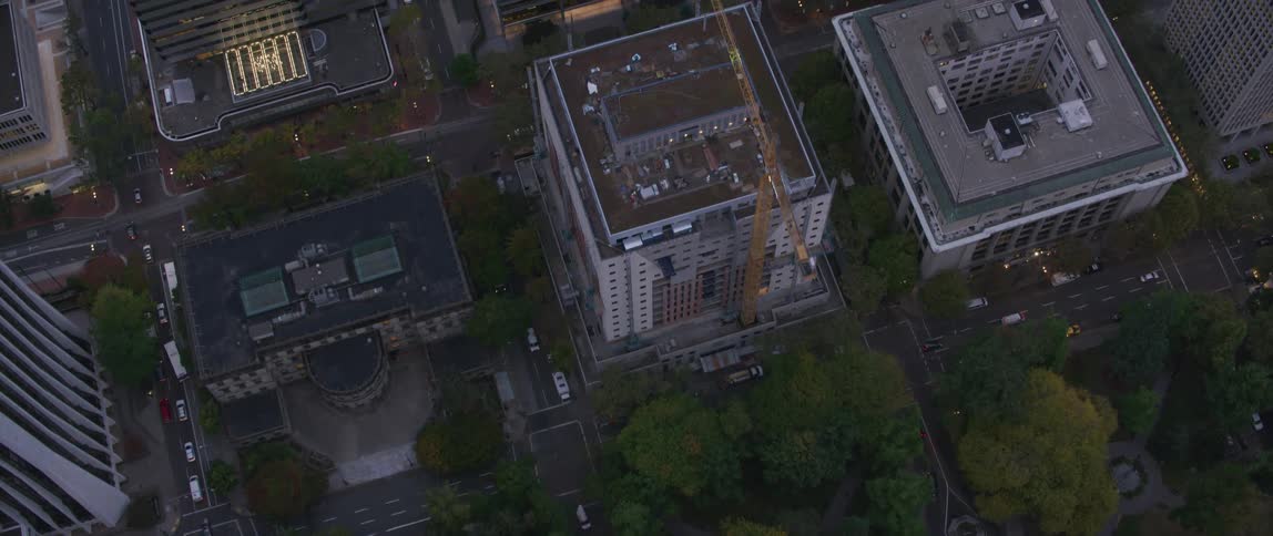 Vehicles travel down the city streets