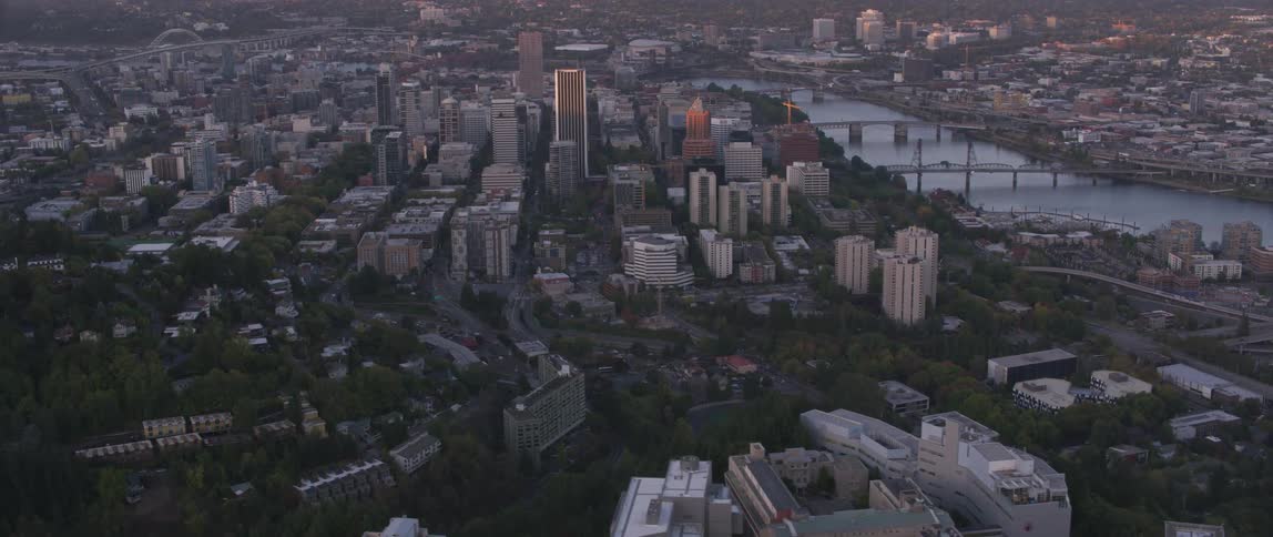 Buildings stand in a city at sunrise
