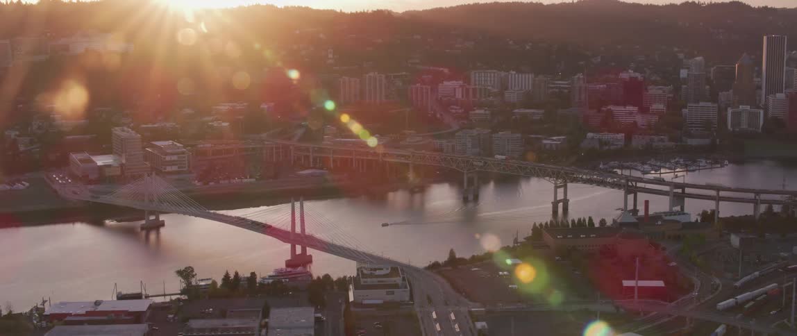 The sun shines on bridges traversing the water way