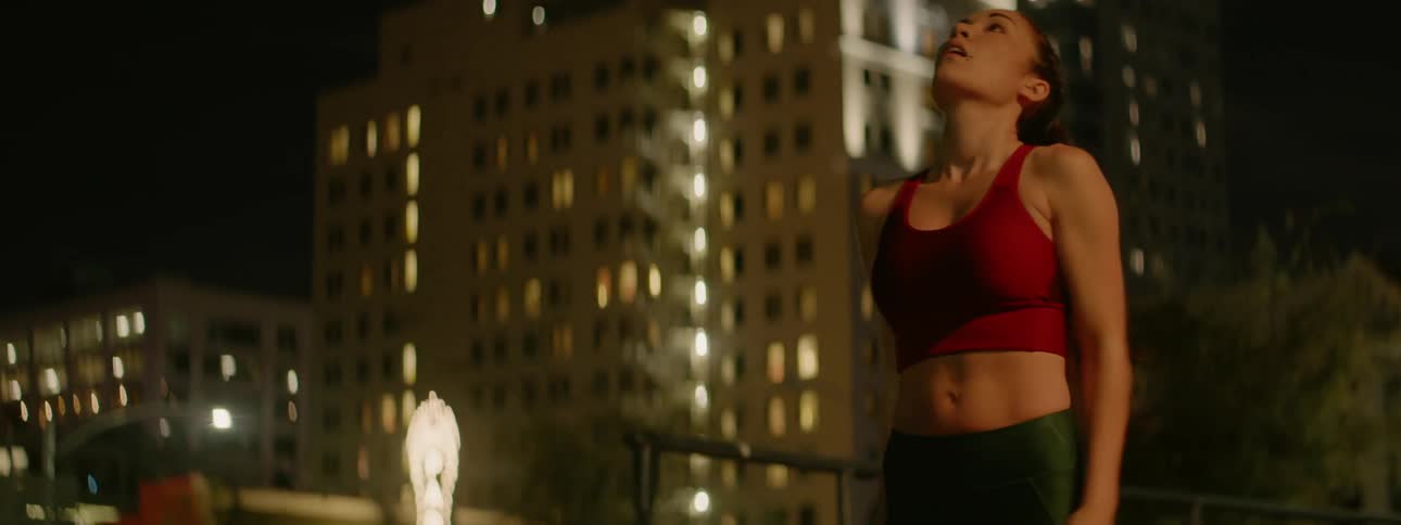 A woman catches her breath after running