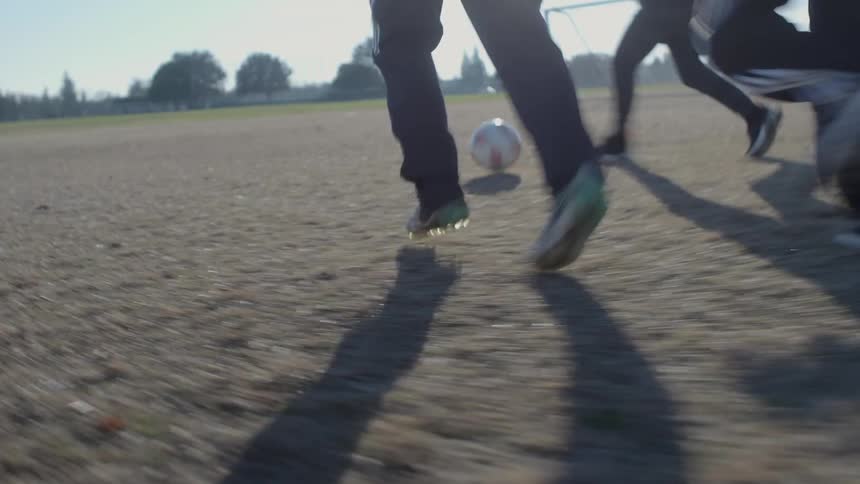 Children get off their bikes and play soccer