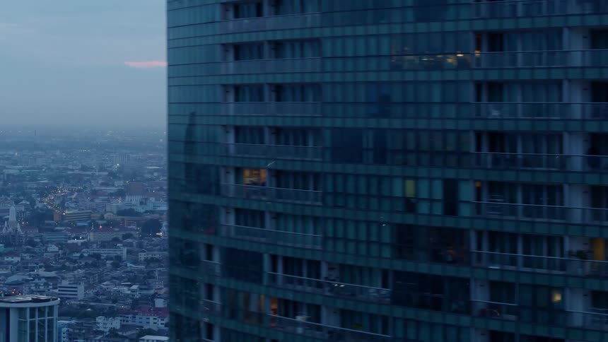 City skyscrapers and landscape glow at sunset