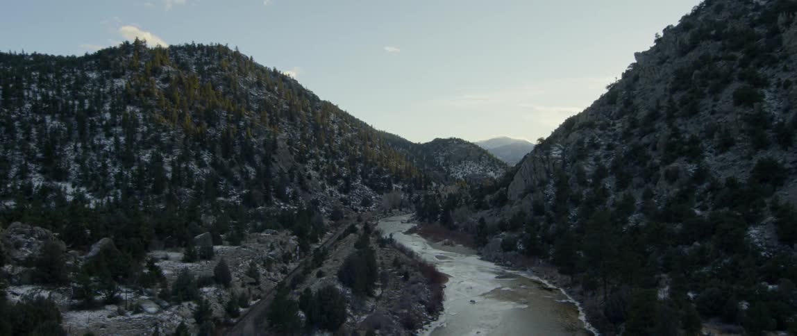River flows through snowy hills