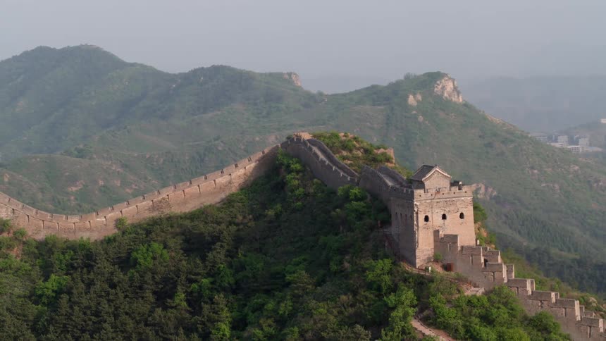 A wall stretches across a tall mountain