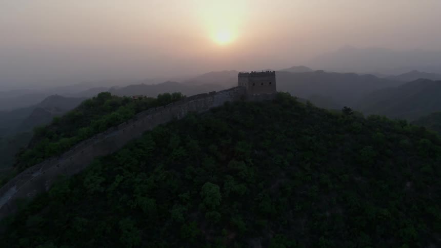 The great wall of china on the ridge at sunset
