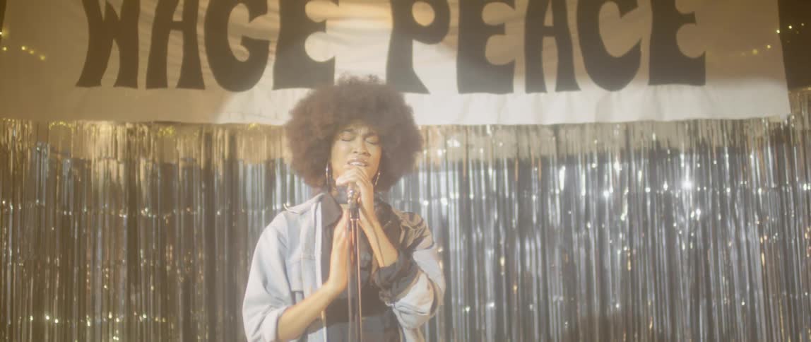 A woman performs on stage