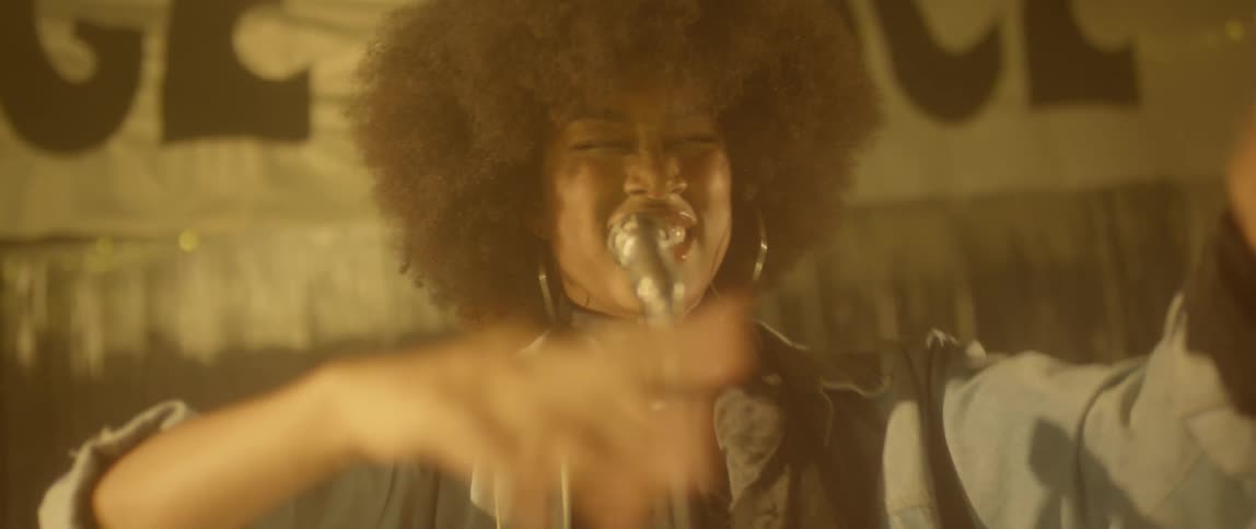 Woman sings and claps her hands
