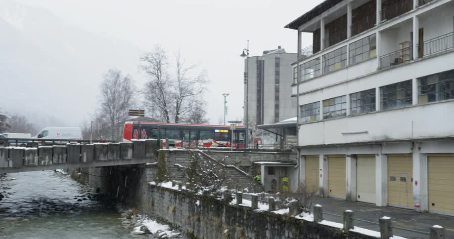 The bus drives over the busy bridge