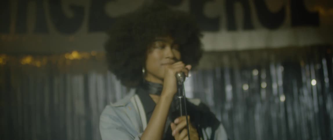 A woman speaks into a microphone