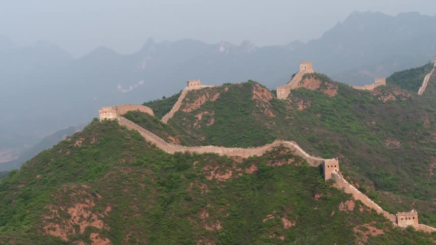 A stone wall stretches across the mountain