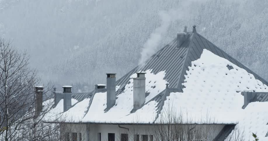 Smoke blows out from a chimney