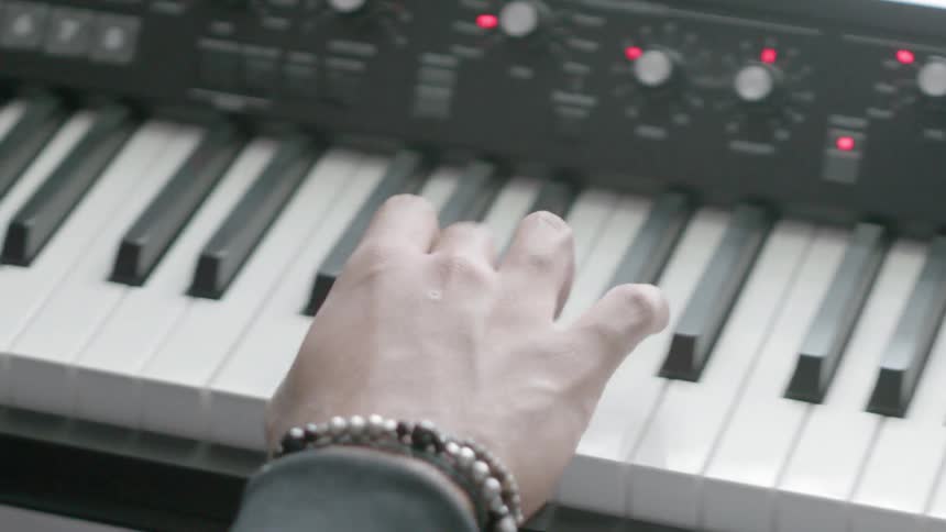 A person is pressing the keys on a keyboard