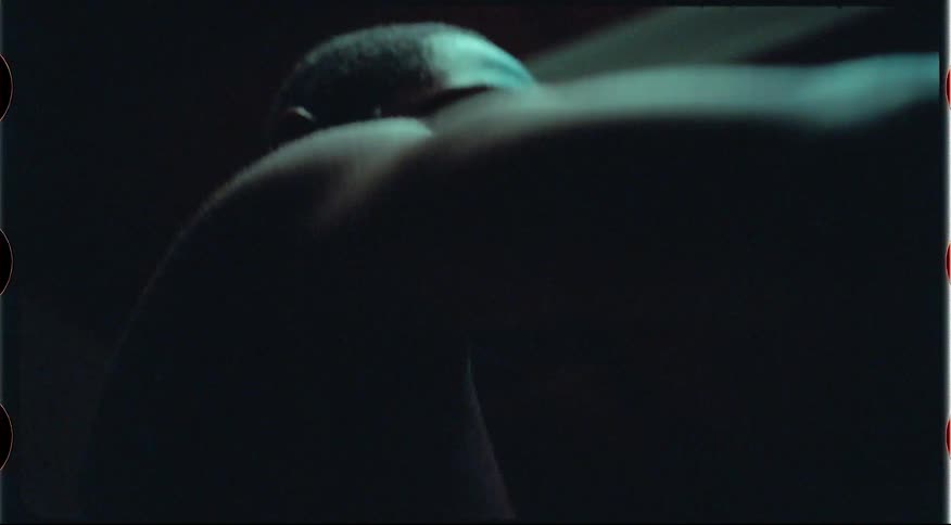 The man is dancing in the dark room