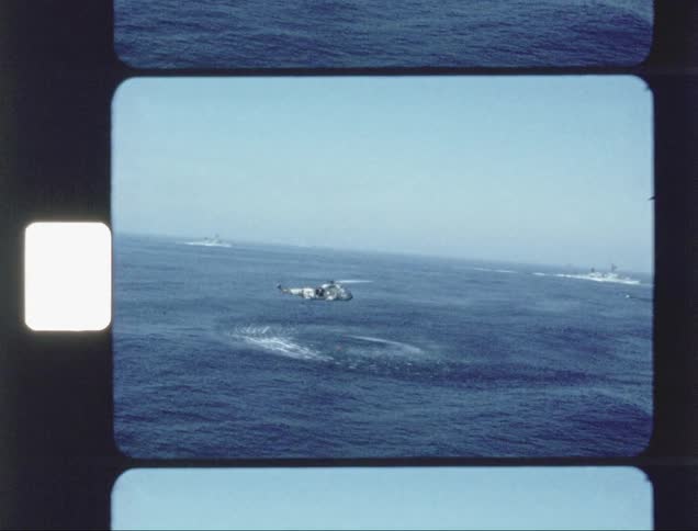 Helicopter flies over an ocean